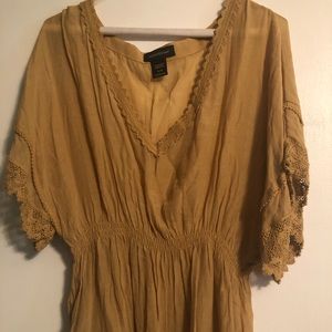 A v-neck tunic with lace accents.